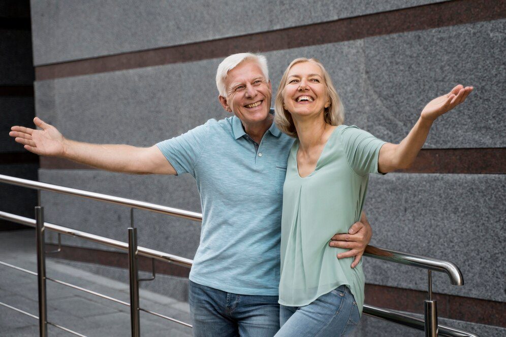 happy senior retired couple posing together outdoors