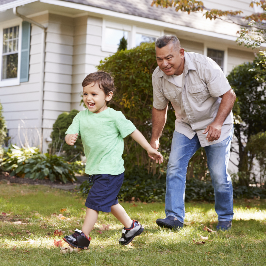 Grandfather playing soccer with grandson – 1