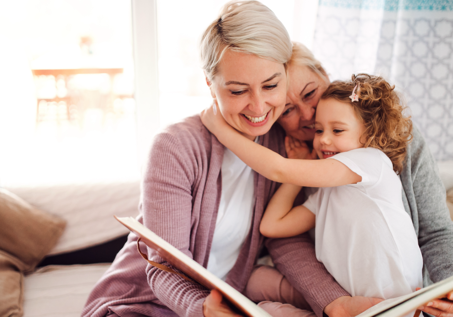 Grandmother reading story to grand daughter